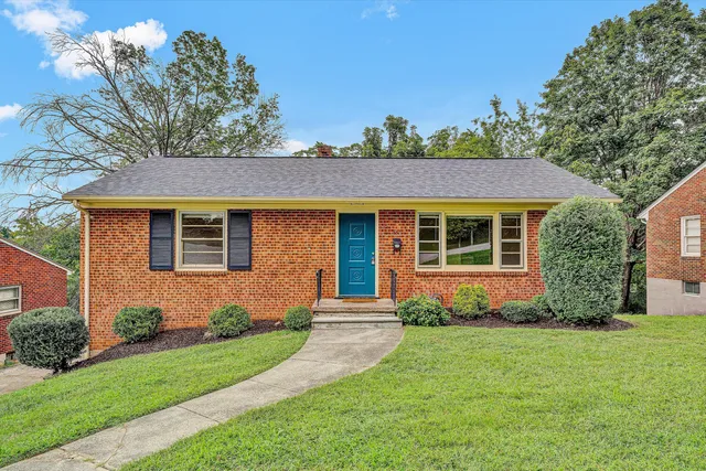 front view of a house with a yard