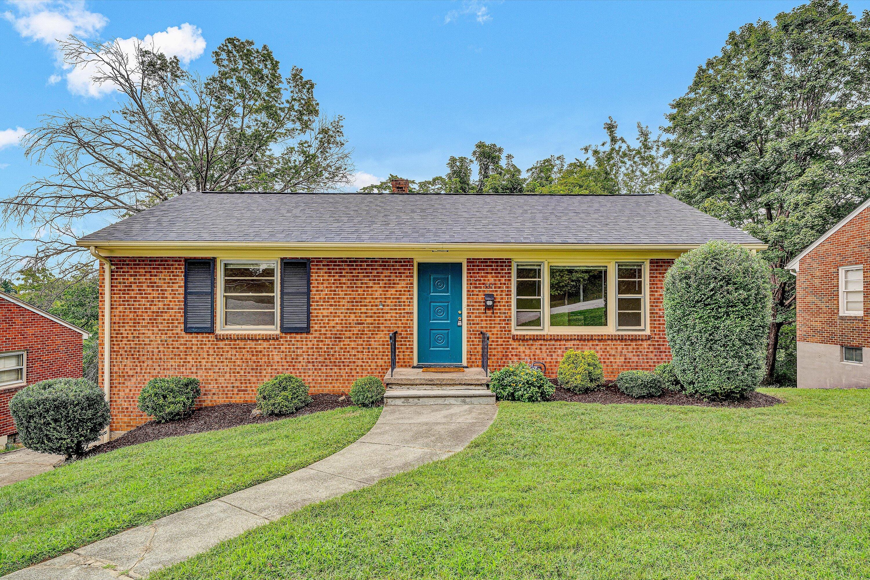 front view of a house with a yard