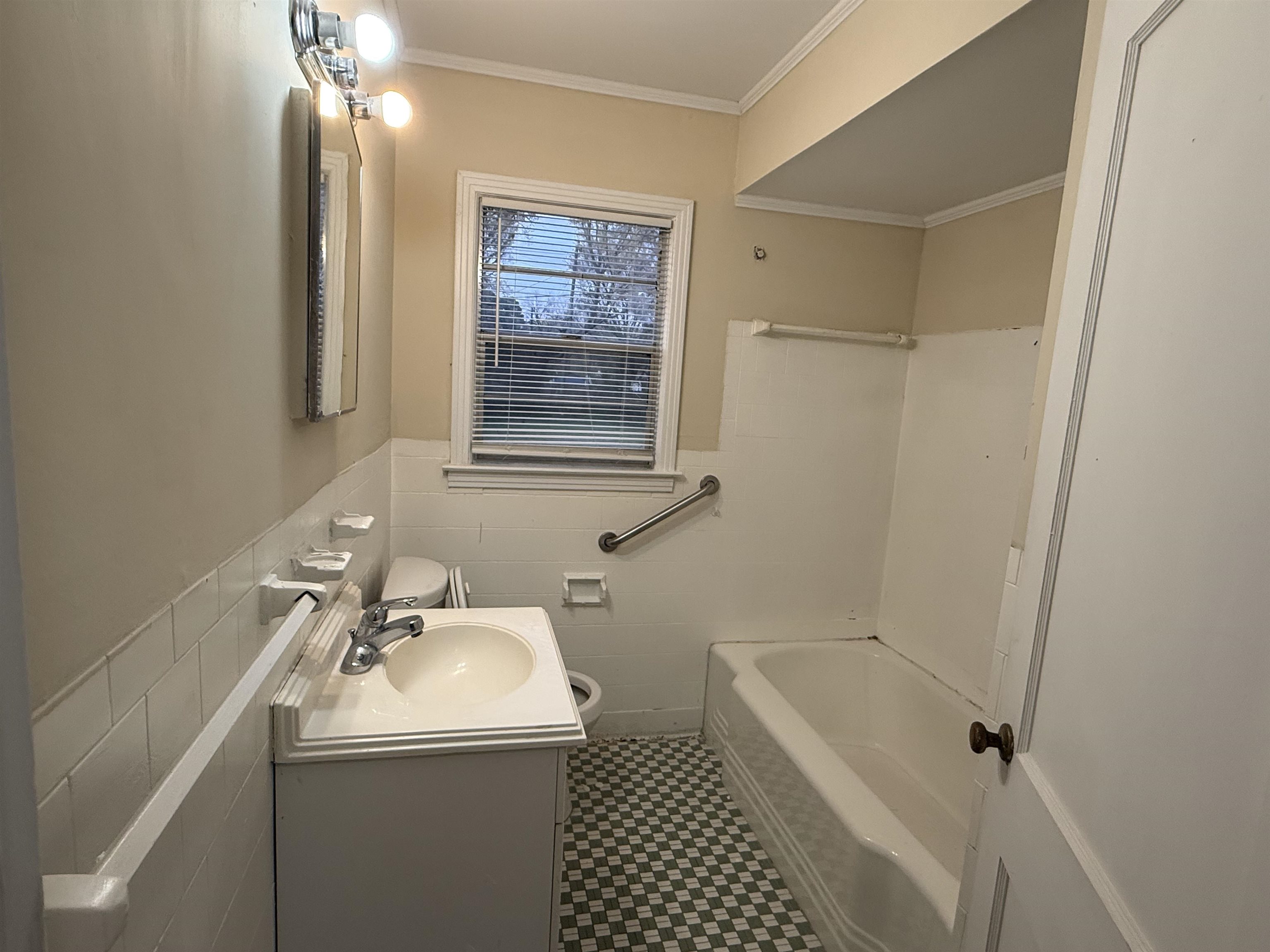 4408 Jamerson Road Memphis, TN 38122 - Photo 11 of 16 a bathroom with a sink a toilet and shower
