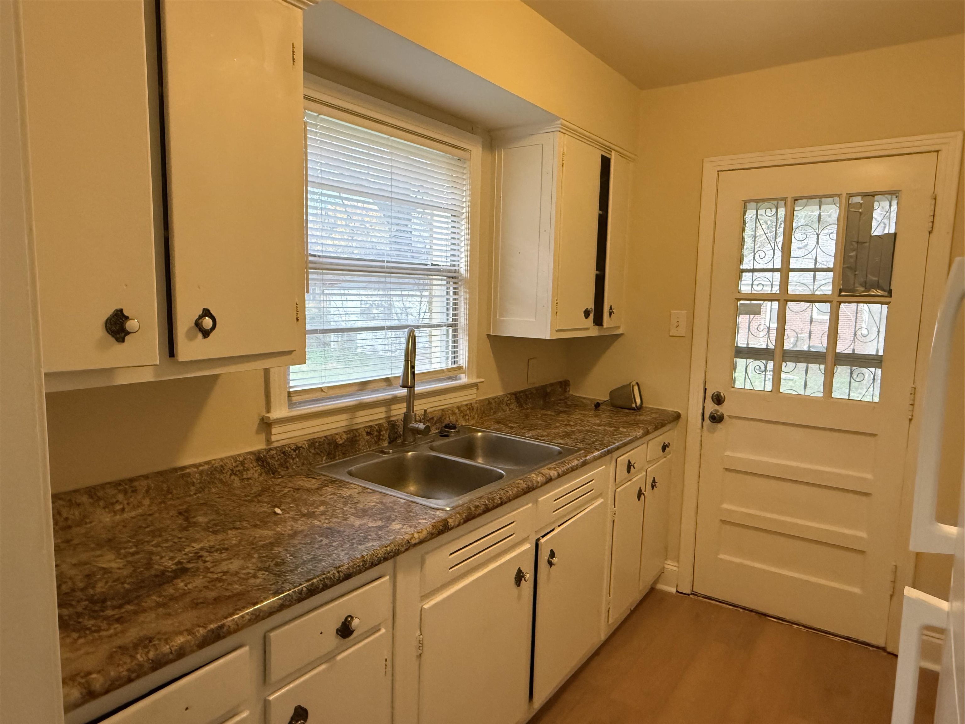 4408 Jamerson Road Memphis, TN 38122 - Photo 6 of 16 a kitchen that has a sink and a window