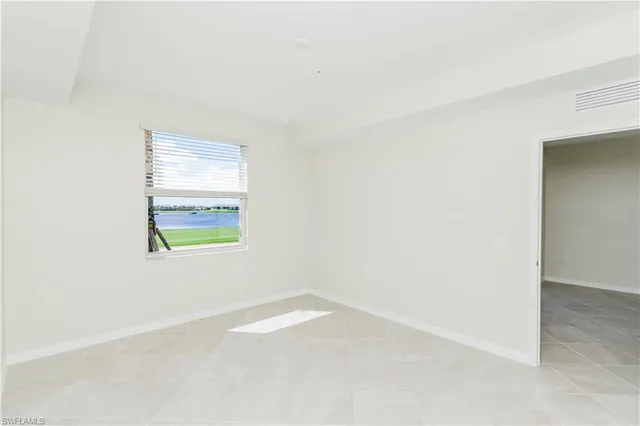 a view of an empty room and window