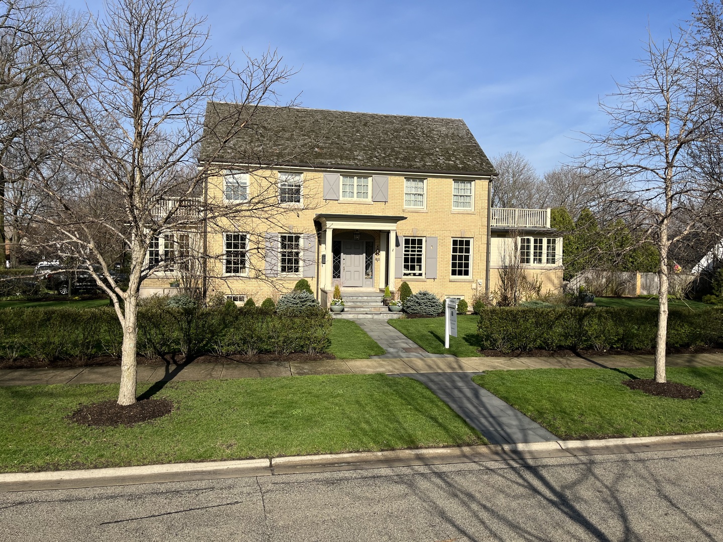 a front view of a house with a yard