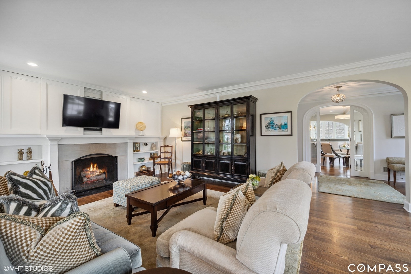 460 Berkeley Avenue Winnetka, IL 60093 - Photo 11 of 45 a living room with furniture a fireplace and a flat screen tv