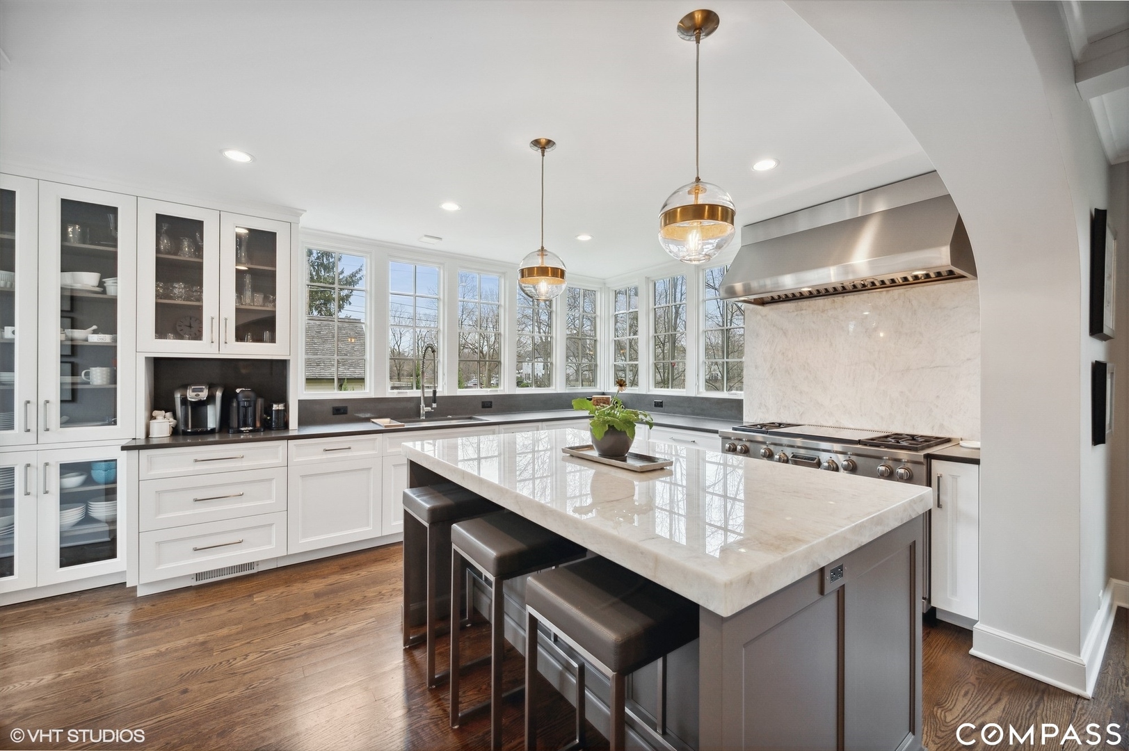 460 Berkeley Avenue Winnetka, IL 60093 - Photo 18 of 45 a kitchen with a sink chandelier and stove