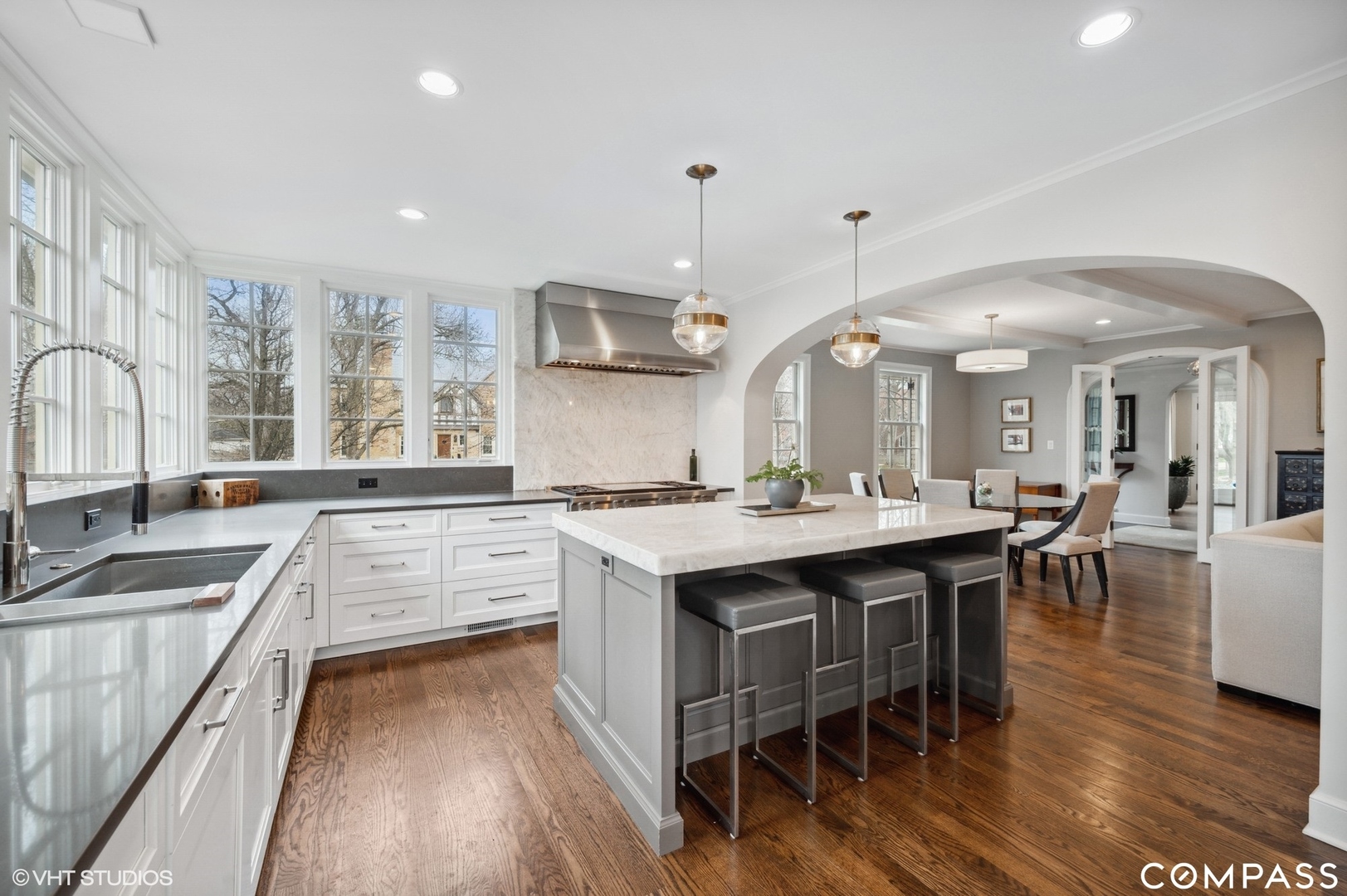 460 Berkeley Avenue Winnetka, IL 60093 - Photo 19 of 45 a large kitchen with a table and chairs in it