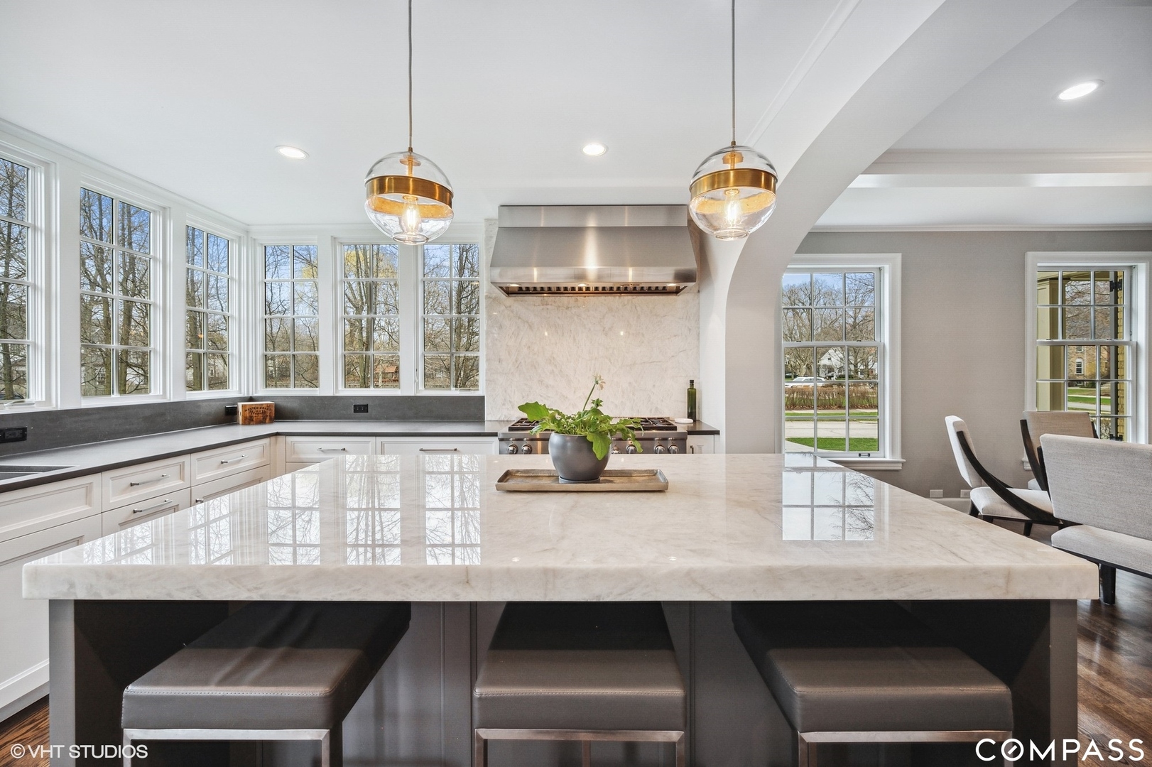460 Berkeley Avenue Winnetka, IL 60093 - Photo 22 of 45 a kitchen with a table and chairs in it