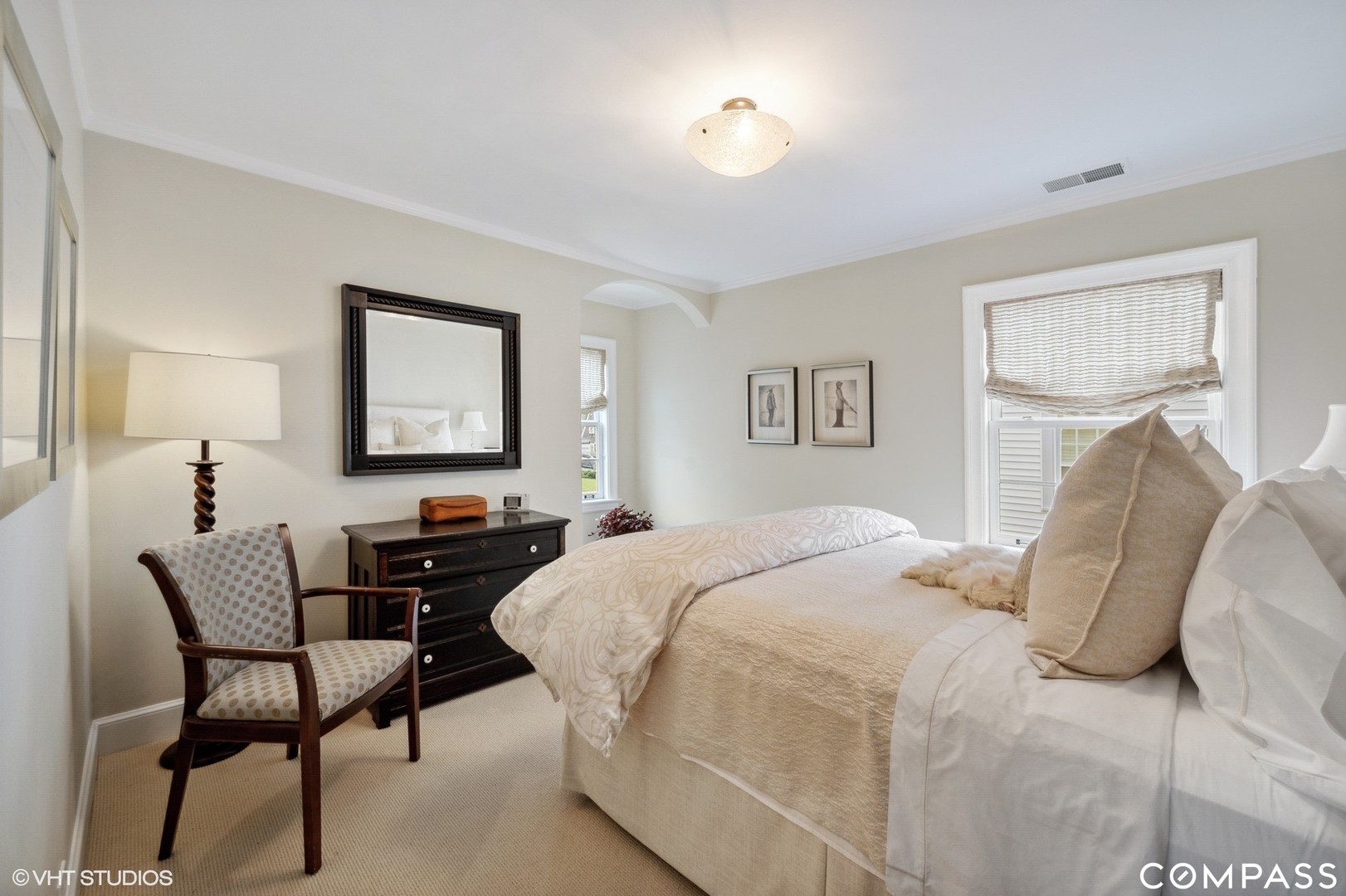 460 Berkeley Avenue Winnetka, IL 60093 - Photo 30 of 45 a bedroom with a bed and a table with mirror