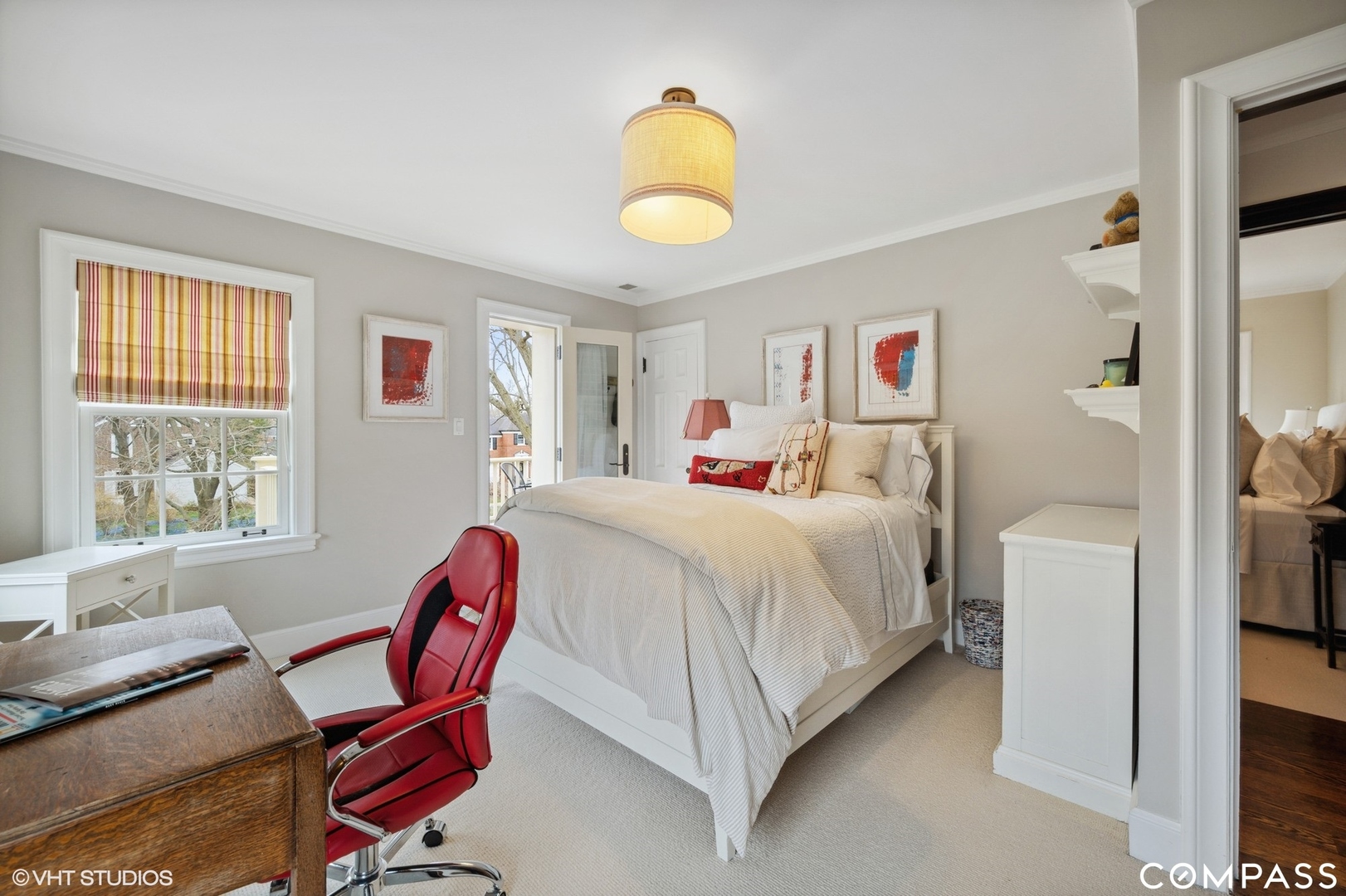 460 Berkeley Avenue Winnetka, IL 60093 - Photo 31 of 45 a bedroom with a bed and a chandelier