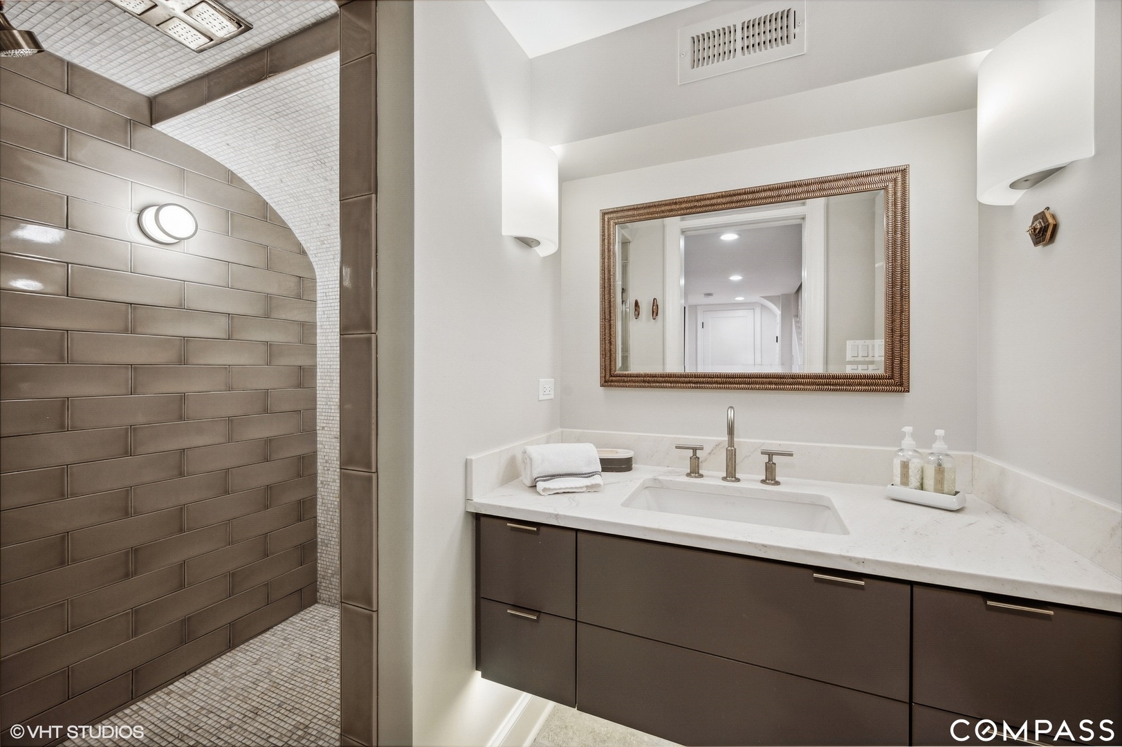 460 Berkeley Avenue Winnetka, IL 60093 - Photo 35 of 45 a bathroom with a sink and a mirror