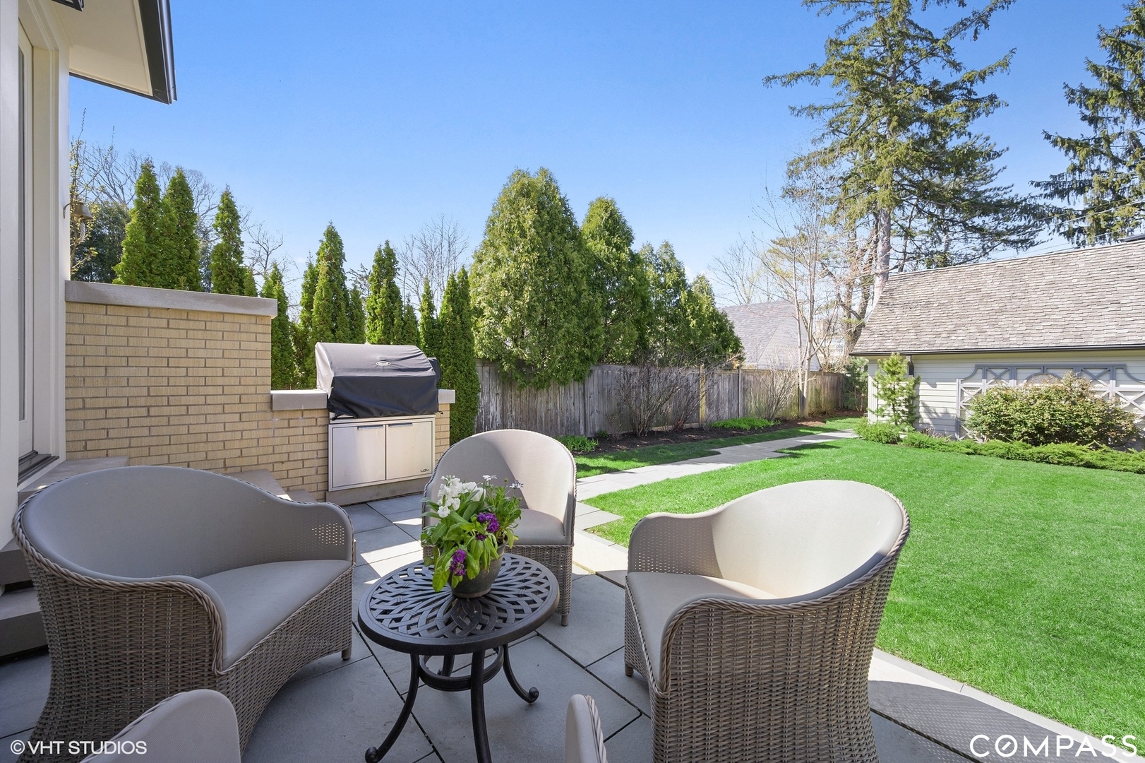 460 Berkeley Avenue Winnetka, IL 60093 - Photo 37 of 45 a view of a chair and table in backyard of the house