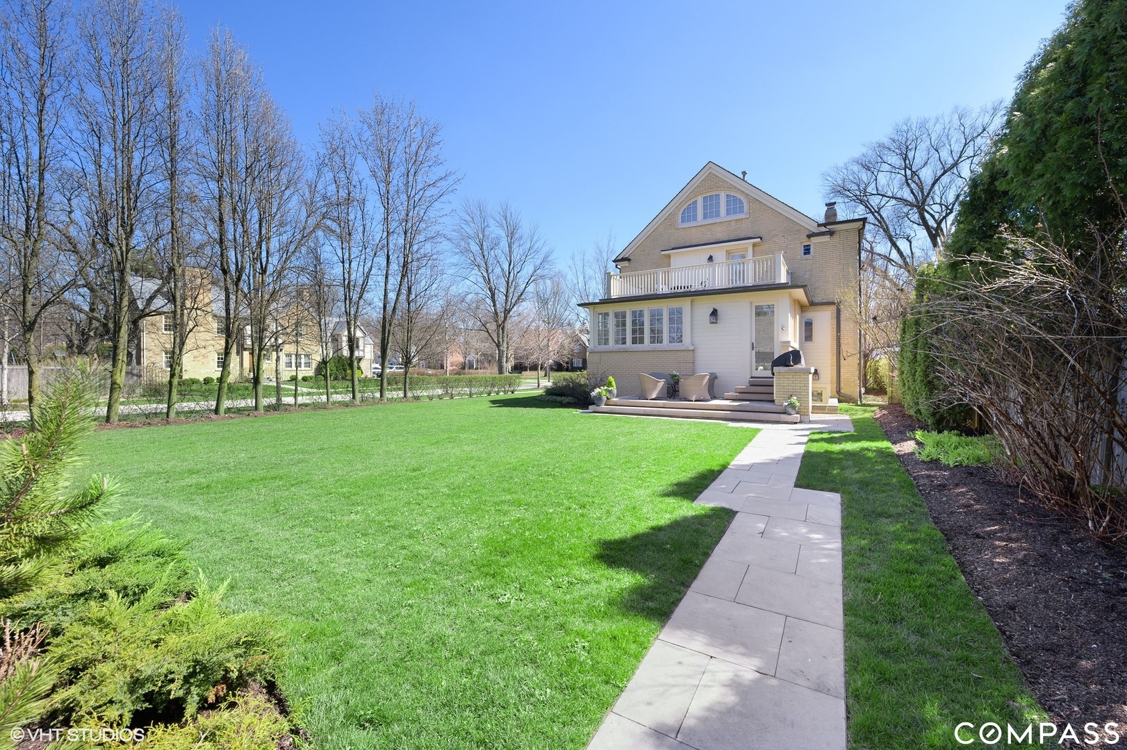 460 Berkeley Avenue Winnetka, IL 60093 - Photo 38 of 45 a front view of a house with a yard and trees
