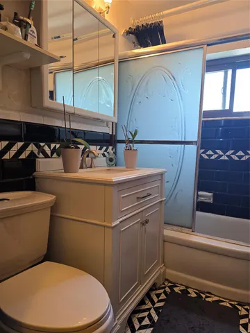 a bathroom with a toilet and a sink