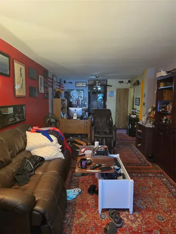 a room with furniture and a wooden floor