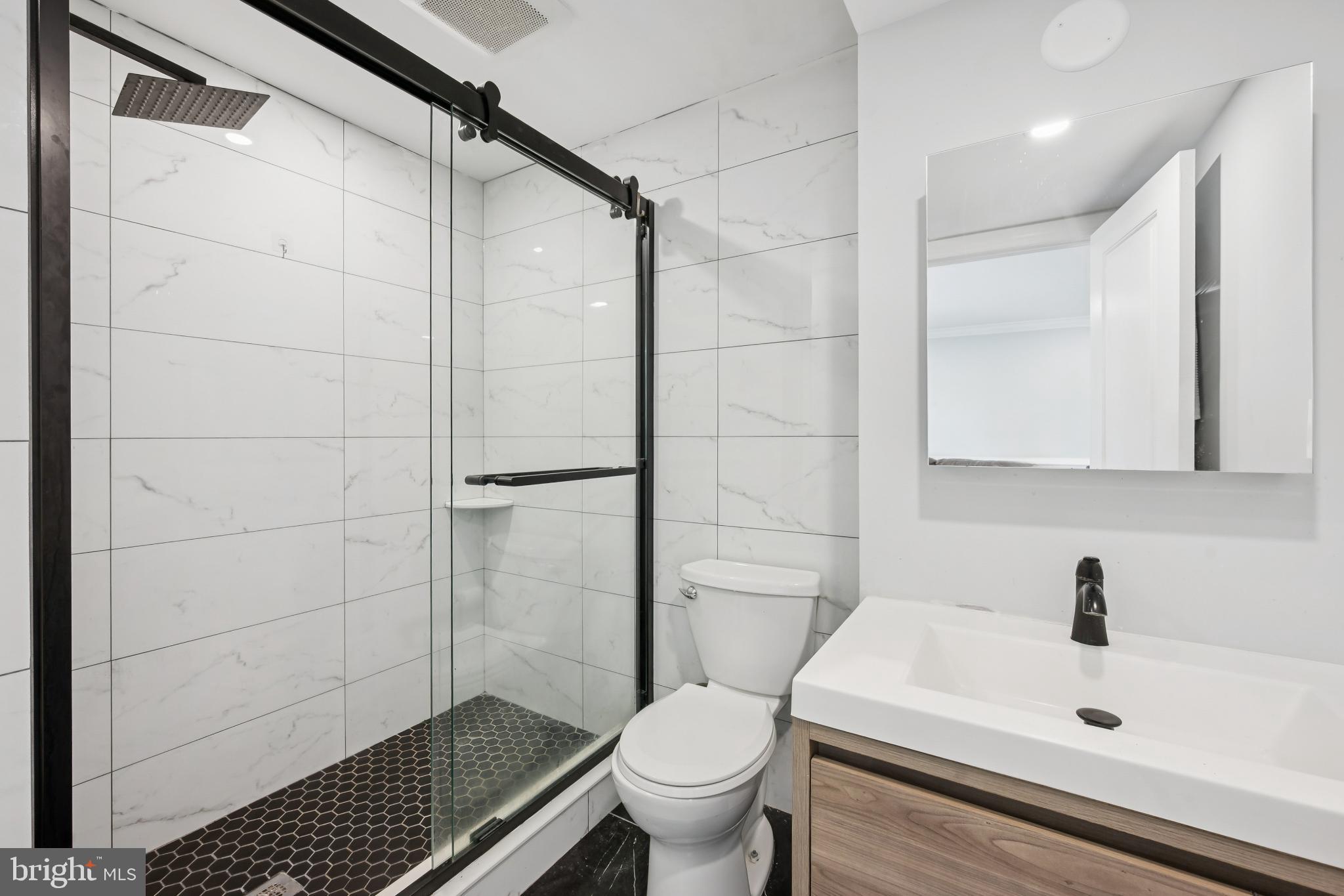 9810 Bridle Road Philadelphia, PA 19115 - Photo 13 of 25 a bathroom with a sink toilet and shower