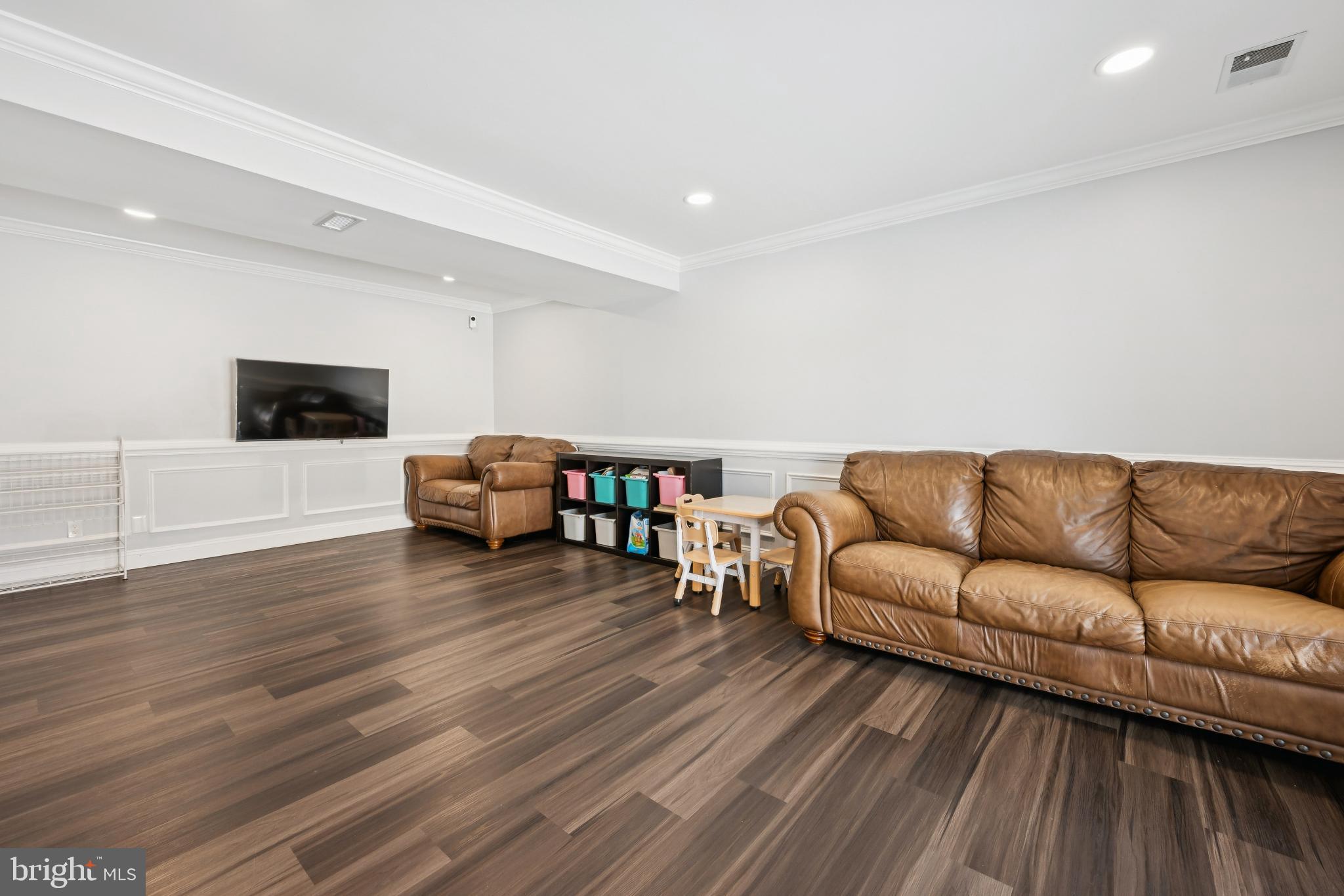 9810 Bridle Road Philadelphia, PA 19115 - Photo 14 of 25 a living room with furniture and a flat screen tv