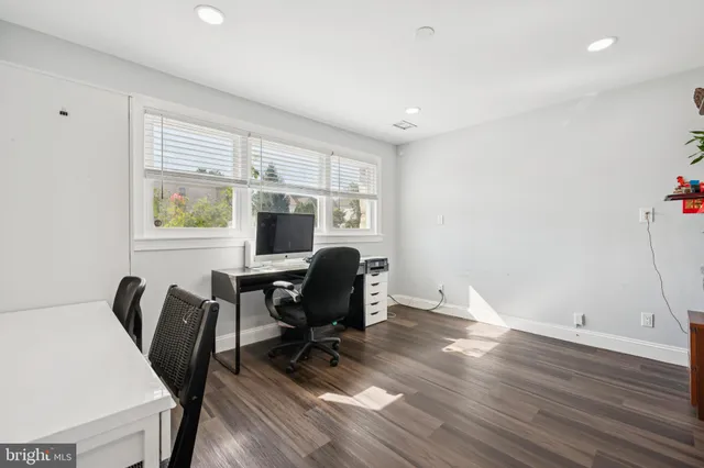 a workspace with furniture hardwood and a window