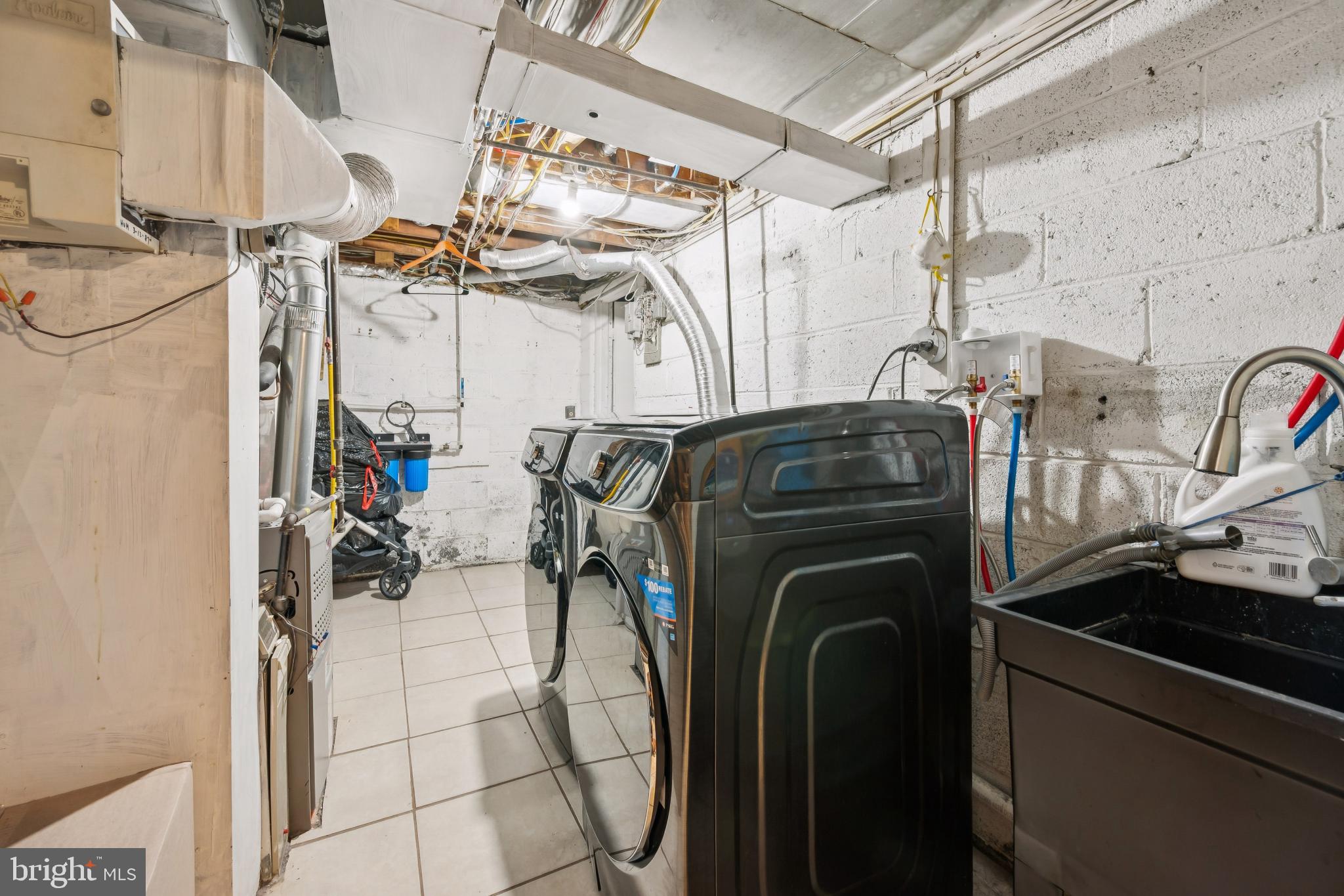 9810 Bridle Road Philadelphia, PA 19115 - Photo 17 of 25 a utility room with multiple dryer and washer