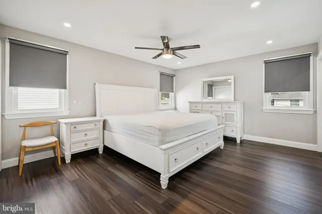 a bedroom with a bed and a chair