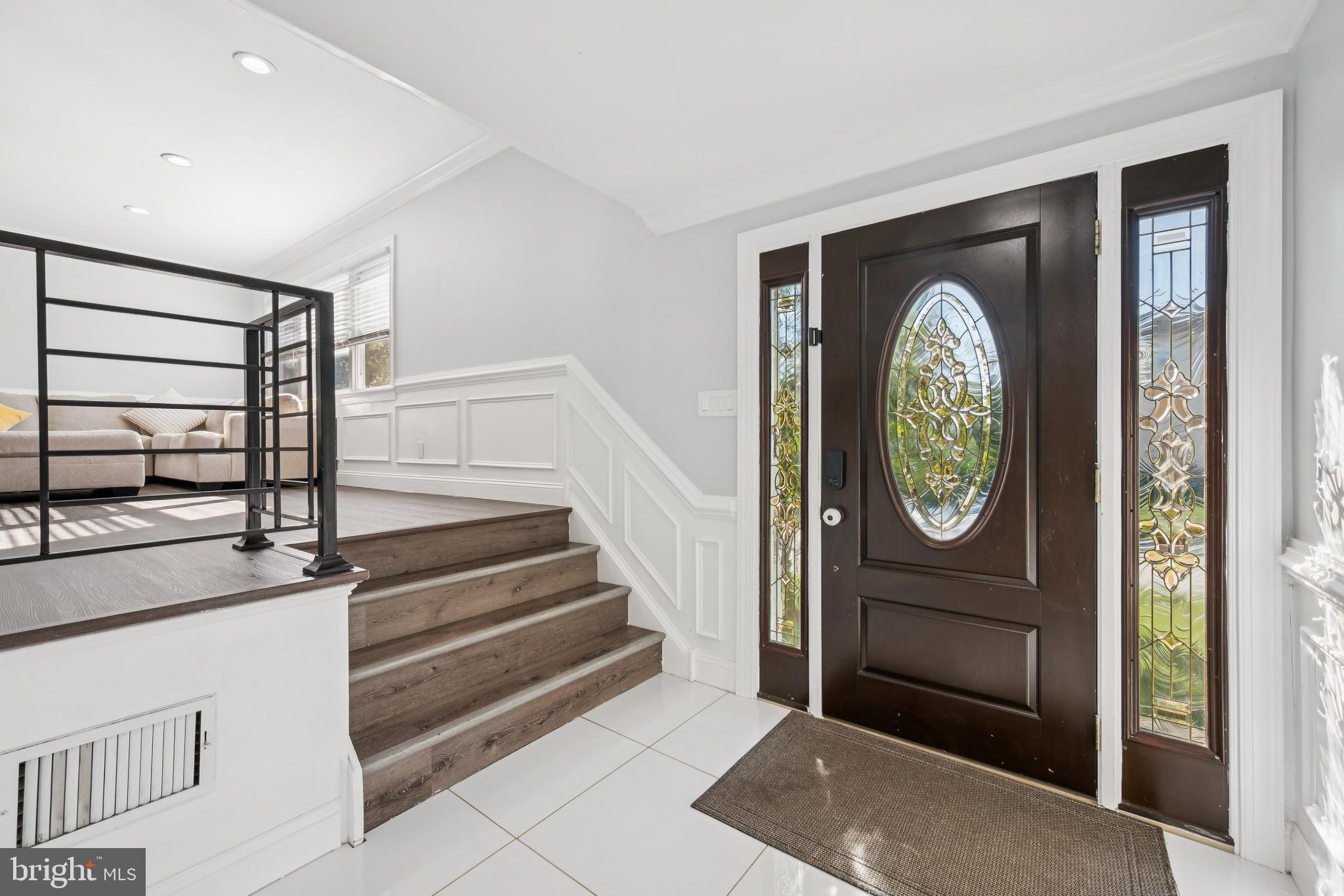 9810 Bridle Road Philadelphia, PA 19115 - Photo 4 of 25 a view of entryway with wooden floor and window