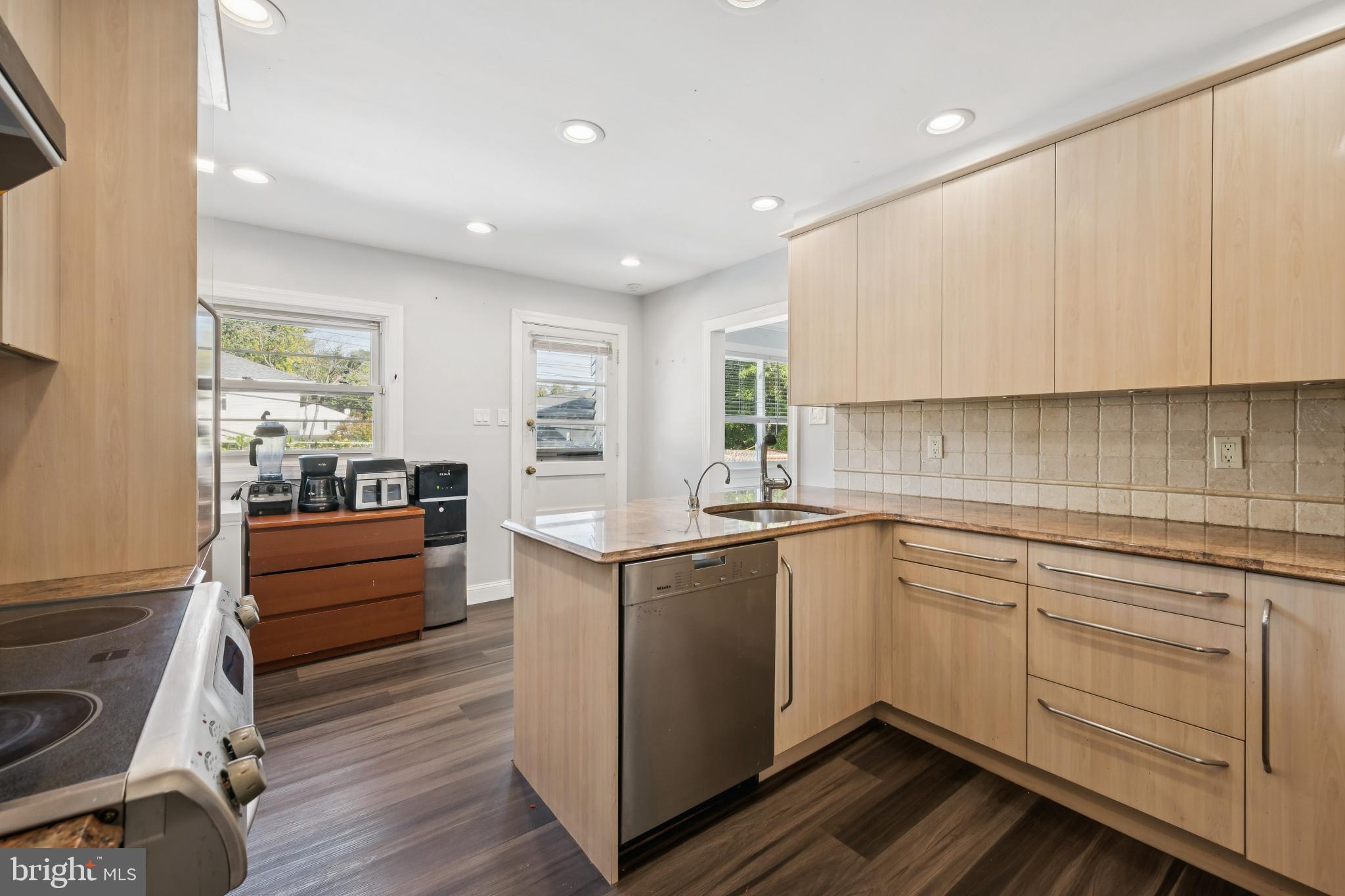 9810 Bridle Road Philadelphia, PA 19115 - Photo 9 of 25 a kitchen with a sink window and cabinets