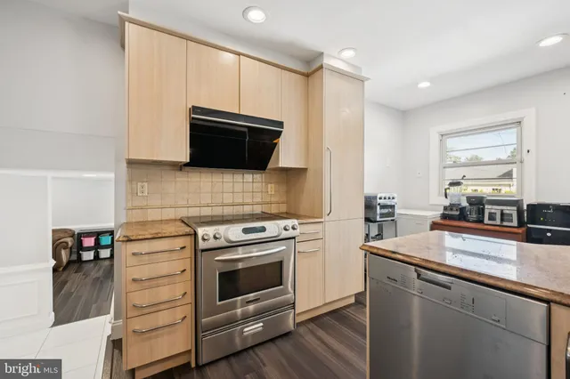 a kitchen with a stove and a microwave