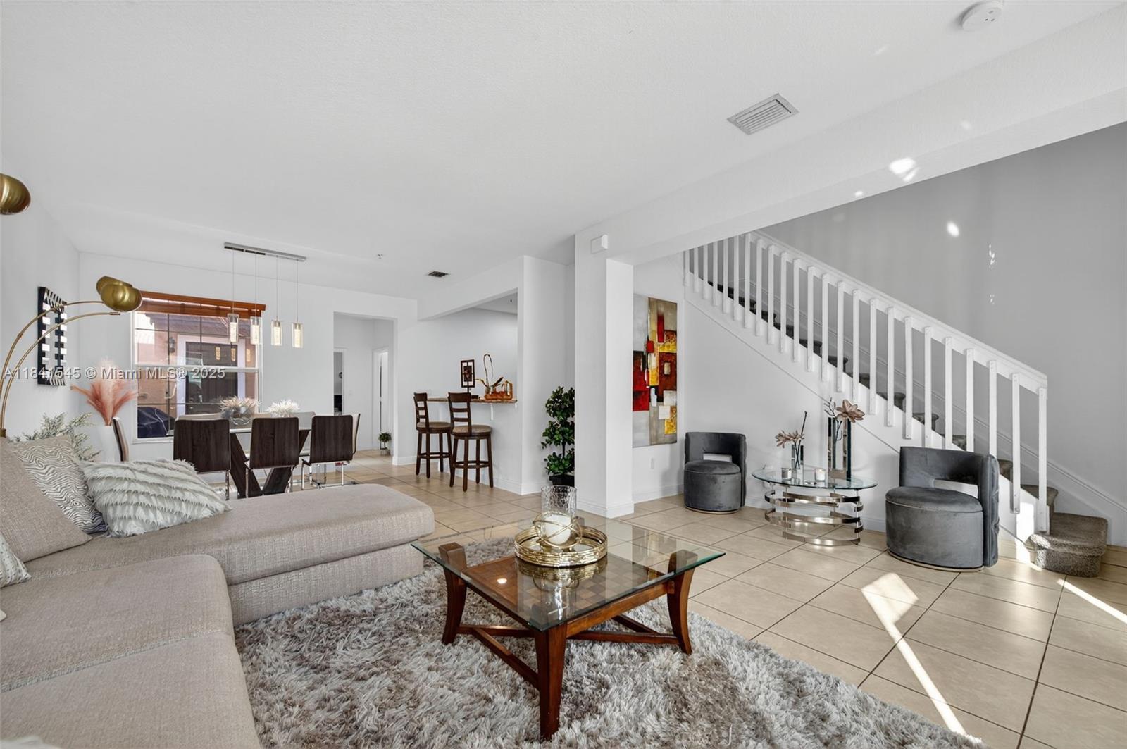 14615 Southwest 14 Street, Unit 14615 Pembroke Pines, FL 33027 - Photo 12 of 49 a living room with furniture