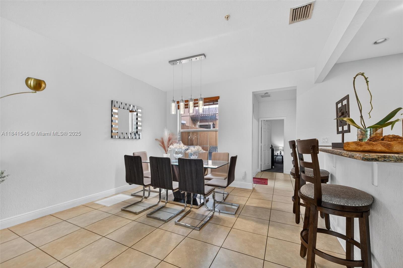 14615 Southwest 14 Street, Unit 14615 Pembroke Pines, FL 33027 - Photo 14 of 49 a view of a dining room with furniture