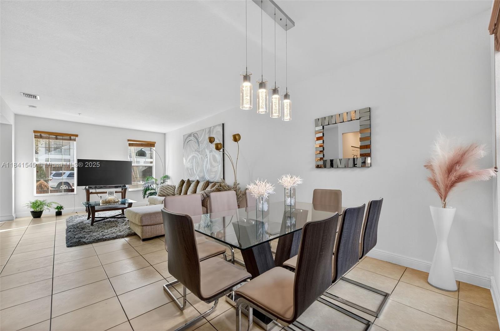 14615 Southwest 14 Street, Unit 14615 Pembroke Pines, FL 33027 - Photo 16 of 49 a view of a dining room with furniture
