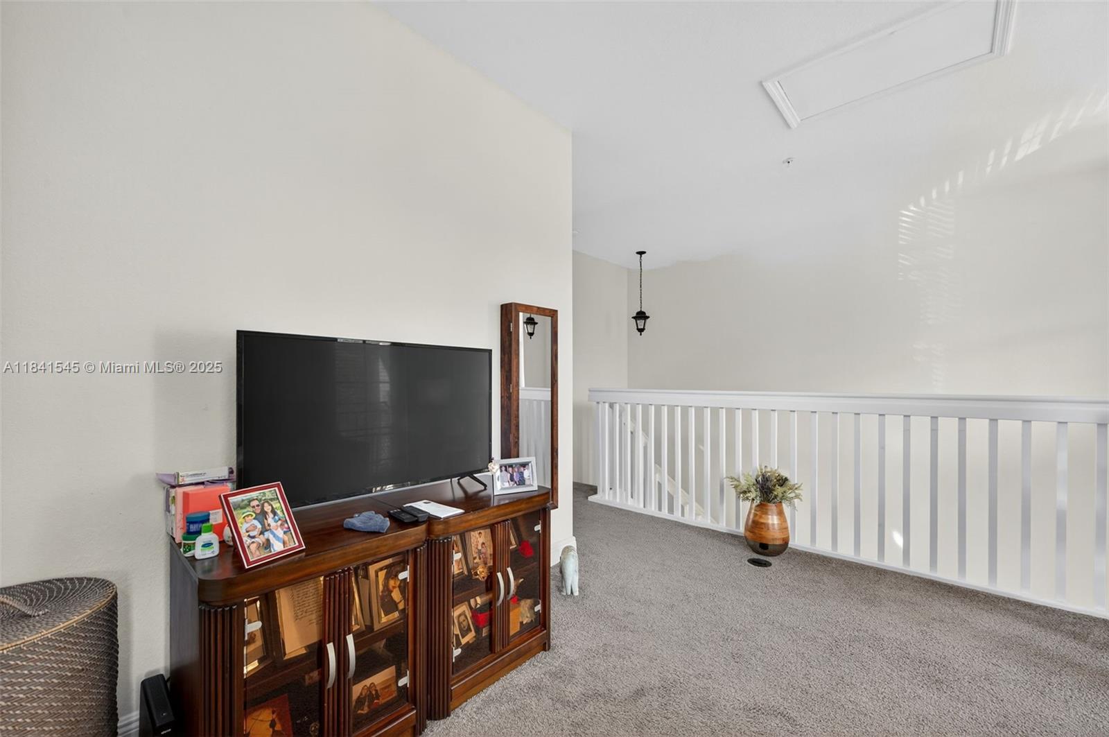 14615 Southwest 14 Street, Unit 14615 Pembroke Pines, FL 33027 - Photo 21 of 49 a living room with furniture and a flat screen tv