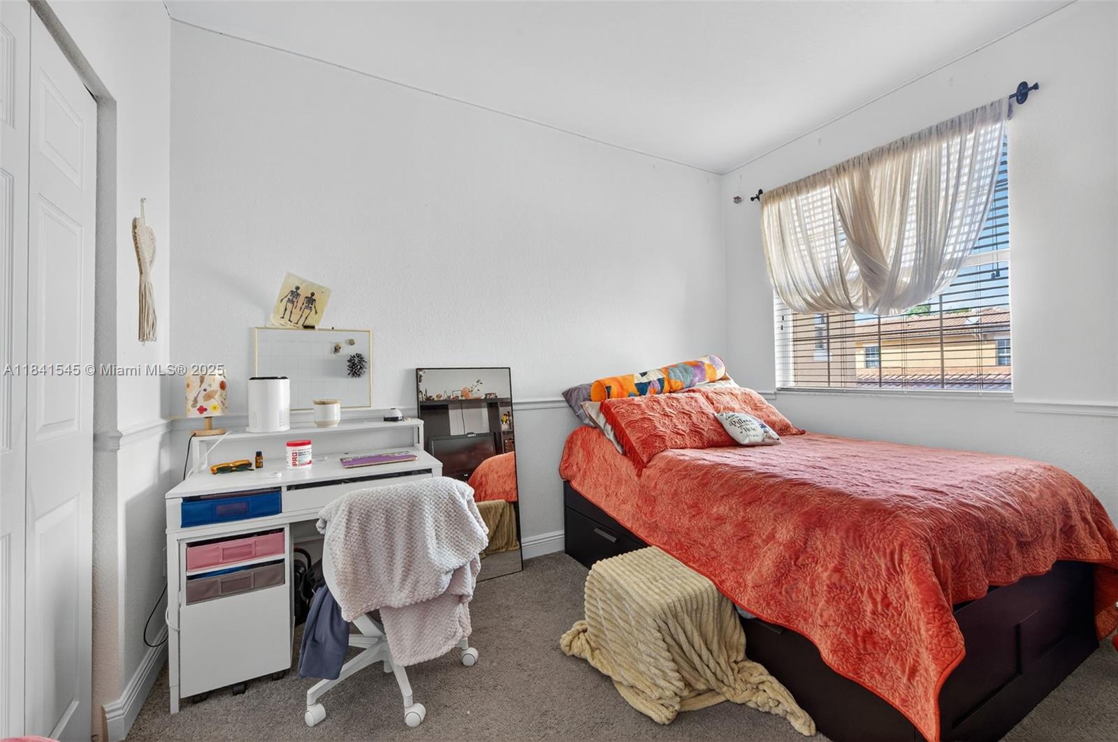 14615 Southwest 14 Street, Unit 14615 Pembroke Pines, FL 33027 - Photo 23 of 49 a bed room with a bed and a chair