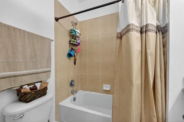 a bathroom with a shower and a tub