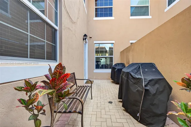 a view of balcony with furniture