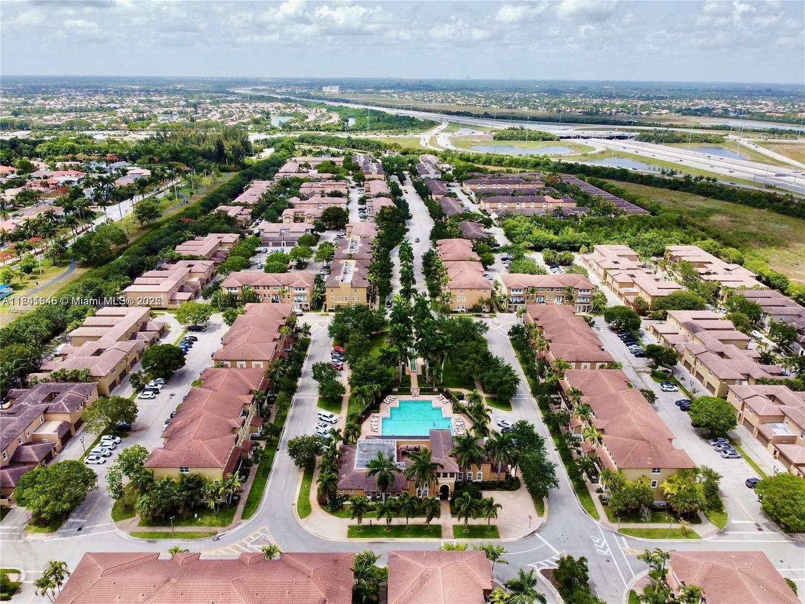 14615 Southwest 14 Street, Unit 14615 Pembroke Pines, FL 33027 - Photo 4 of 49 an aerial view of a city