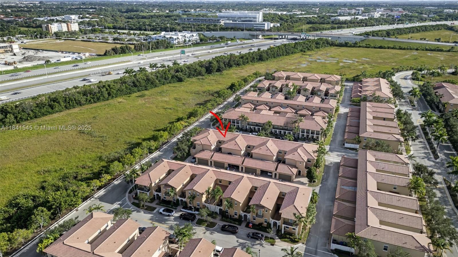 14615 Southwest 14 Street, Unit 14615 Pembroke Pines, FL 33027 - Photo 44 of 49 an aerial view of a city and lake view