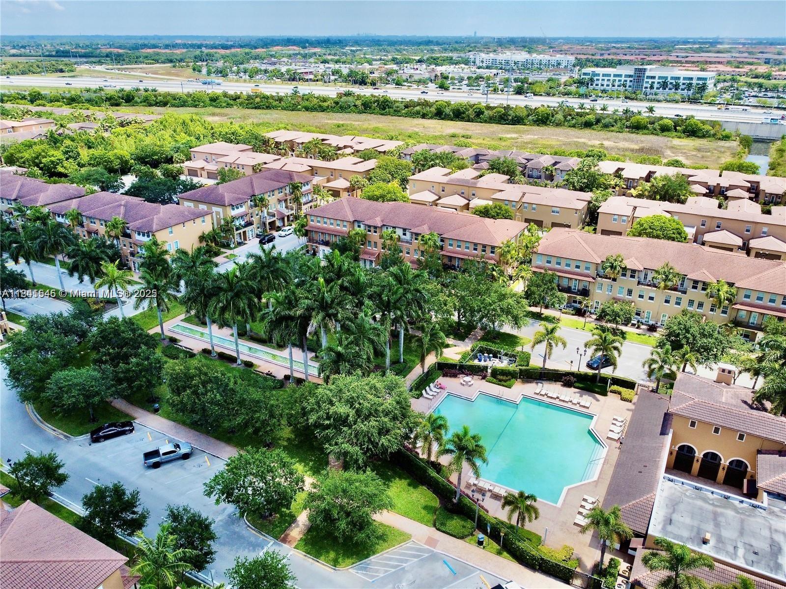 14615 Southwest 14 Street, Unit 14615 Pembroke Pines, FL 33027 - Photo 5 of 49 an aerial view of residential houses with outdoor space and river