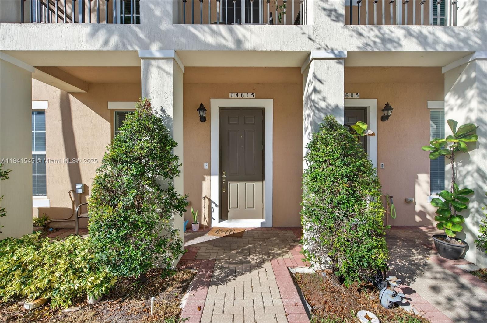 14615 Southwest 14 Street, Unit 14615 Pembroke Pines, FL 33027 - Photo 9 of 49 front view of a house with a porch