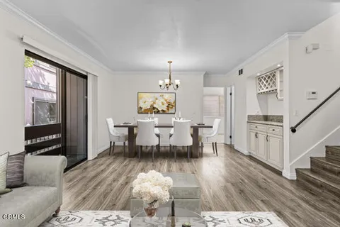 a view of a dining room with furniture window and wooden floor