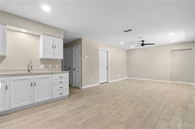 a bathroom with a granite countertop sink mirror and