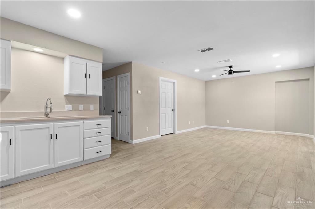 712 Toronto Avenue McAllen, TX 78503 - Photo 3 of 13 a bathroom with a granite countertop sink mirror and