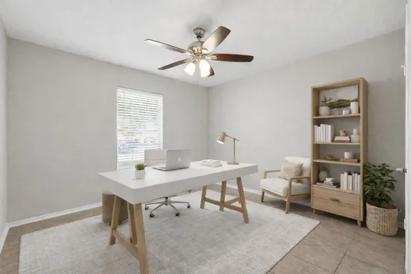 a workspace with furniture and window