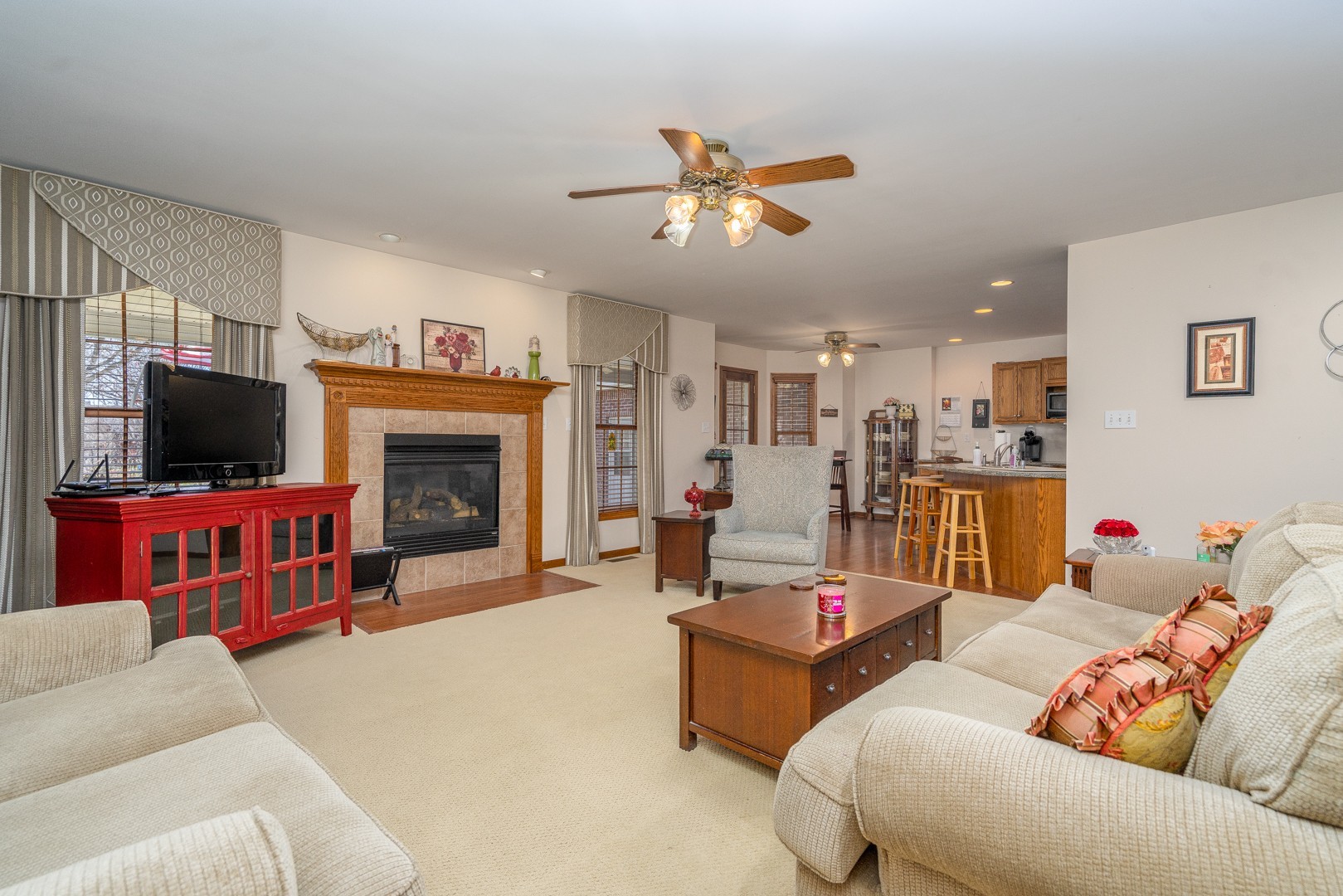1715 Willow Road Morris, IL 60450 - Photo 2 of 22 a living room with furniture kitchen view and a fireplace