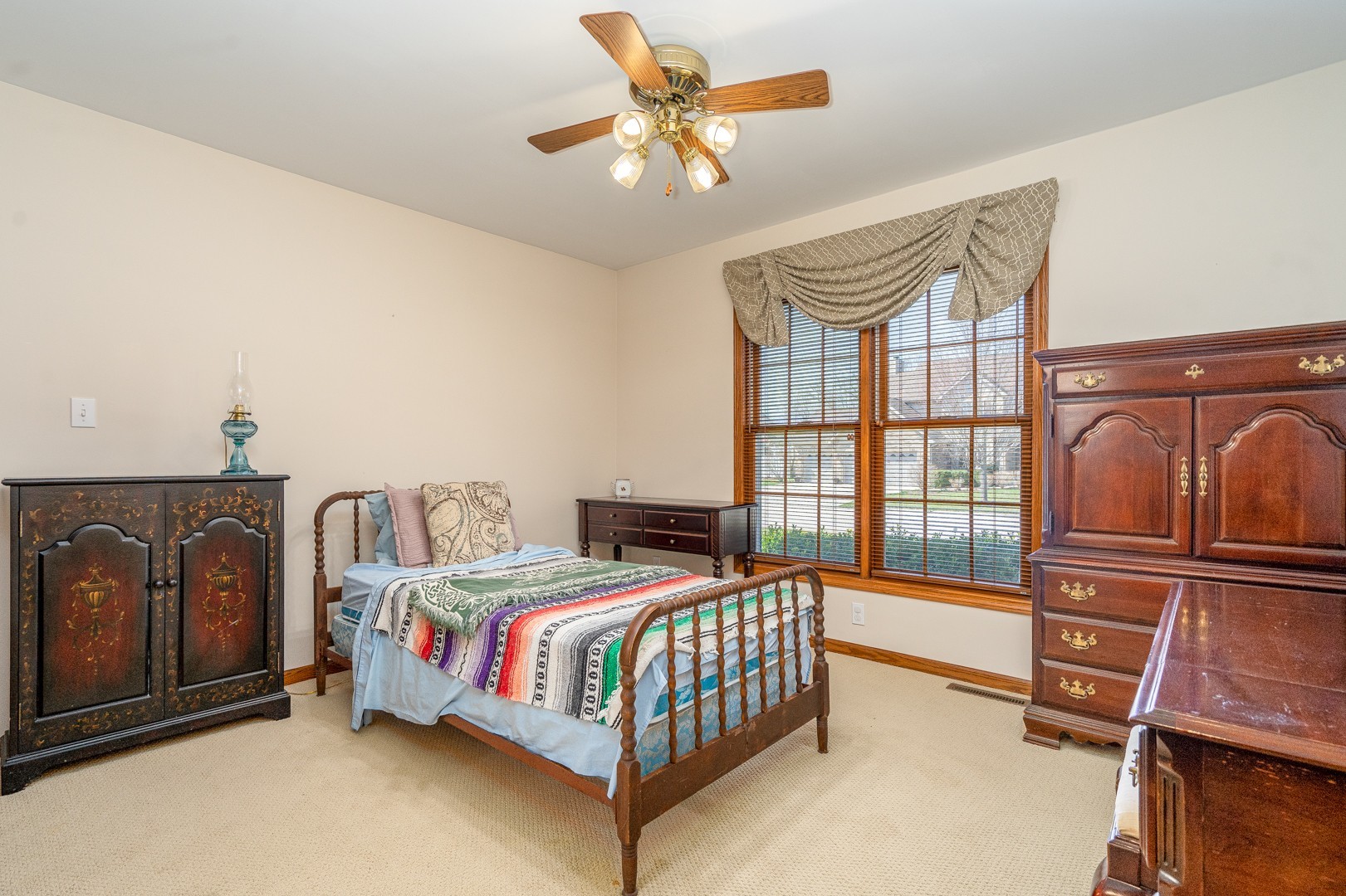1715 Willow Road Morris, IL 60450 - Photo 13 of 22 a bedroom with a bed next to a window