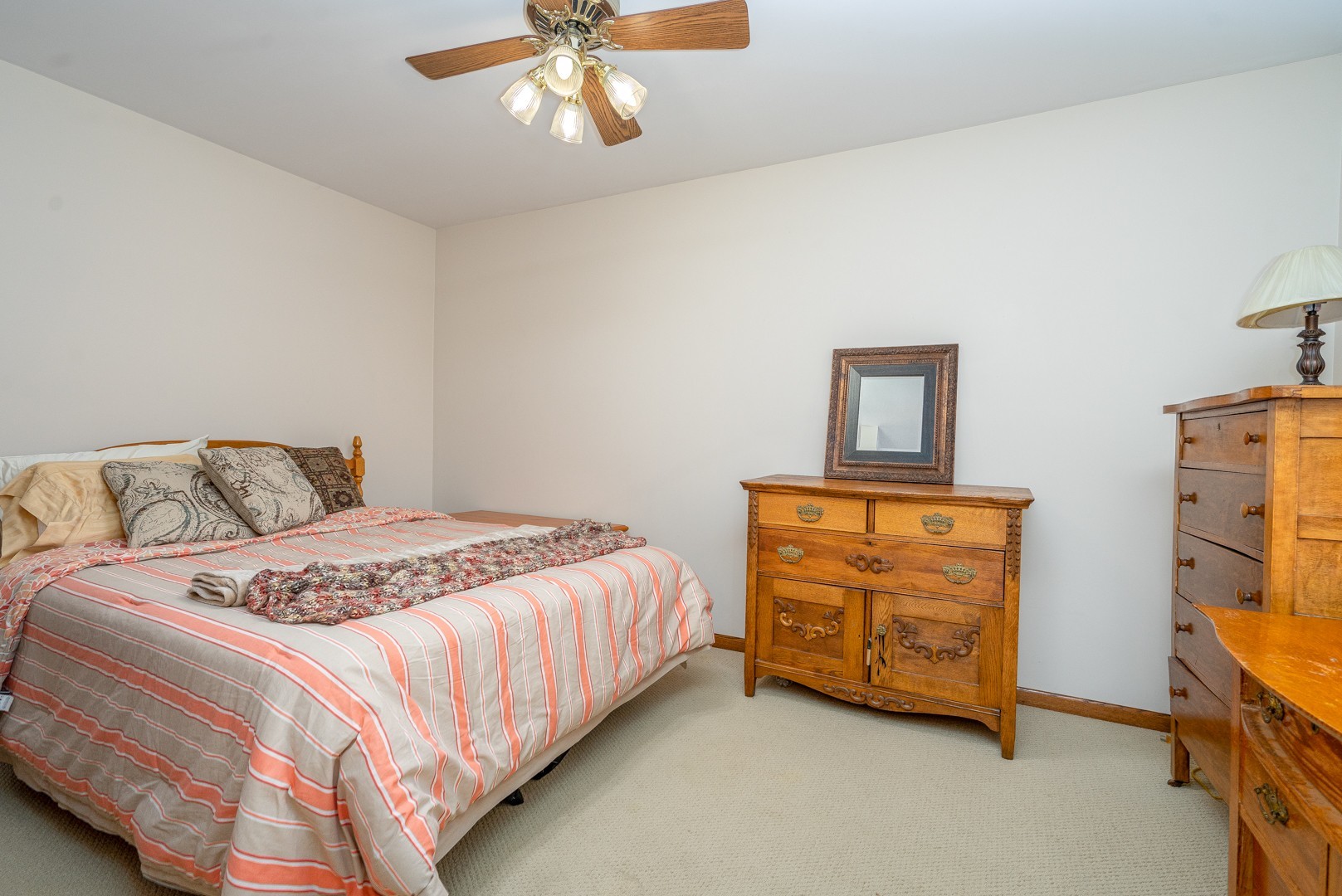 1715 Willow Road Morris, IL 60450 - Photo 14 of 22 a bedroom with a bed and a chandelier