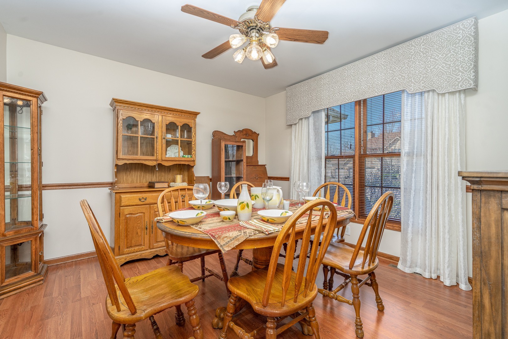 1715 Willow Road Morris, IL 60450 - Photo 8 of 22 a view of a dining room with furniture window and wooden floor