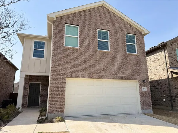 a front view of a house with yard