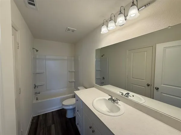a view of kitchen with sink microwave and refrigerator