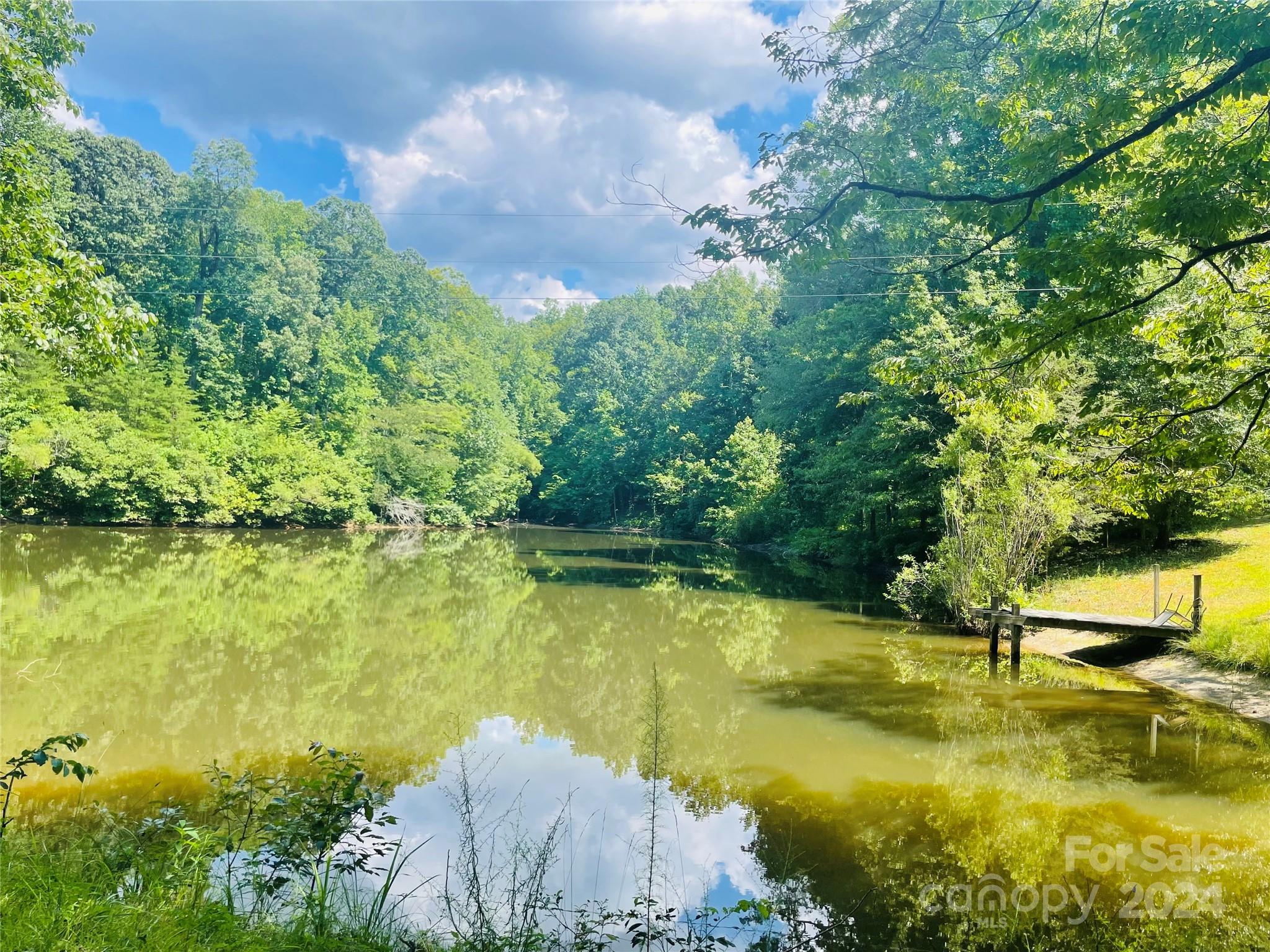 191 Old Hearth Road, Unit 29 Clover, SC 29710 - Photo 21 of 21 a view of a lake with a house in the background