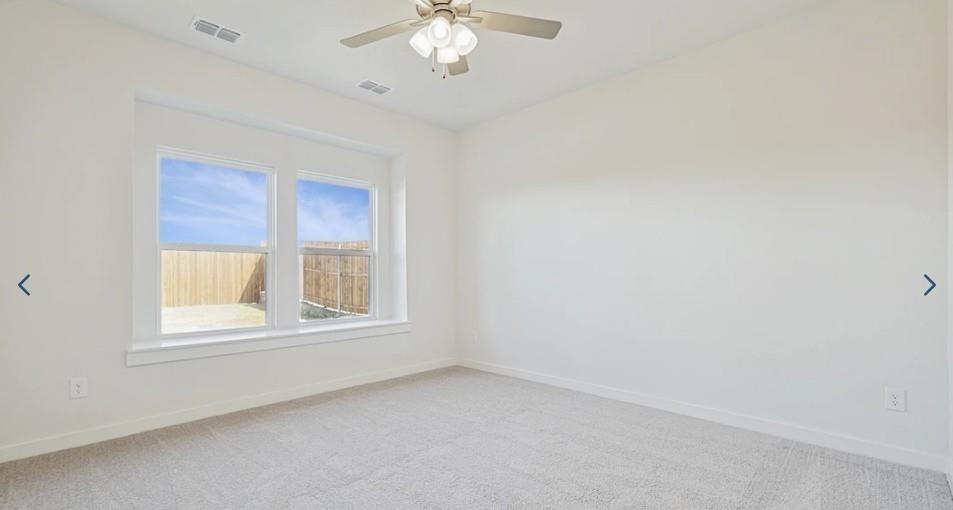520 Weller Road McKinney, TX 75069 - Photo 7 of 12 Empty room with light colored carpet, baseboards, and a ceiling fan