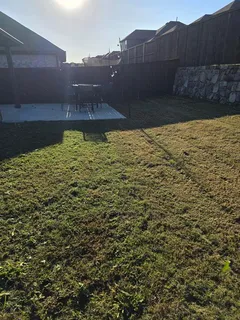 a view of a house with backyard porch and sitting area