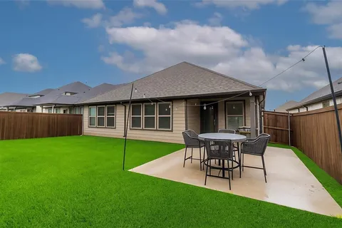 a view of a house with a garden